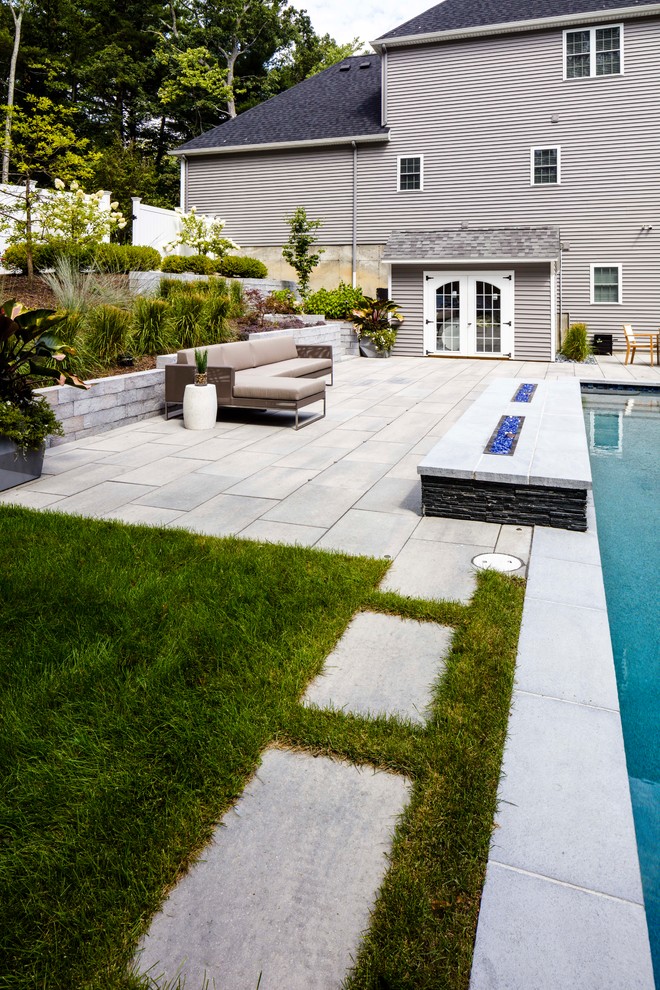 Photo of a large contemporary concrete paver landscaping in Other.