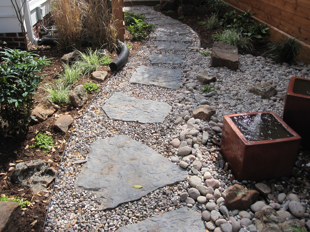 A wrap around garden with a fabulous water featurel! Contemporary