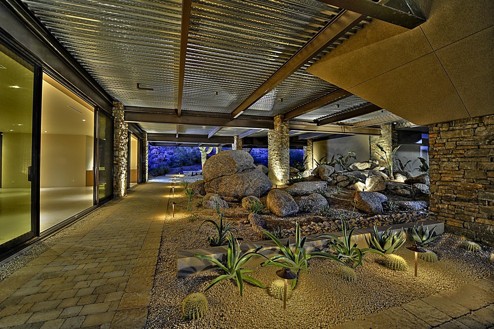 Imagen de jardín de secano contemporáneo grande con adoquines de ladrillo
