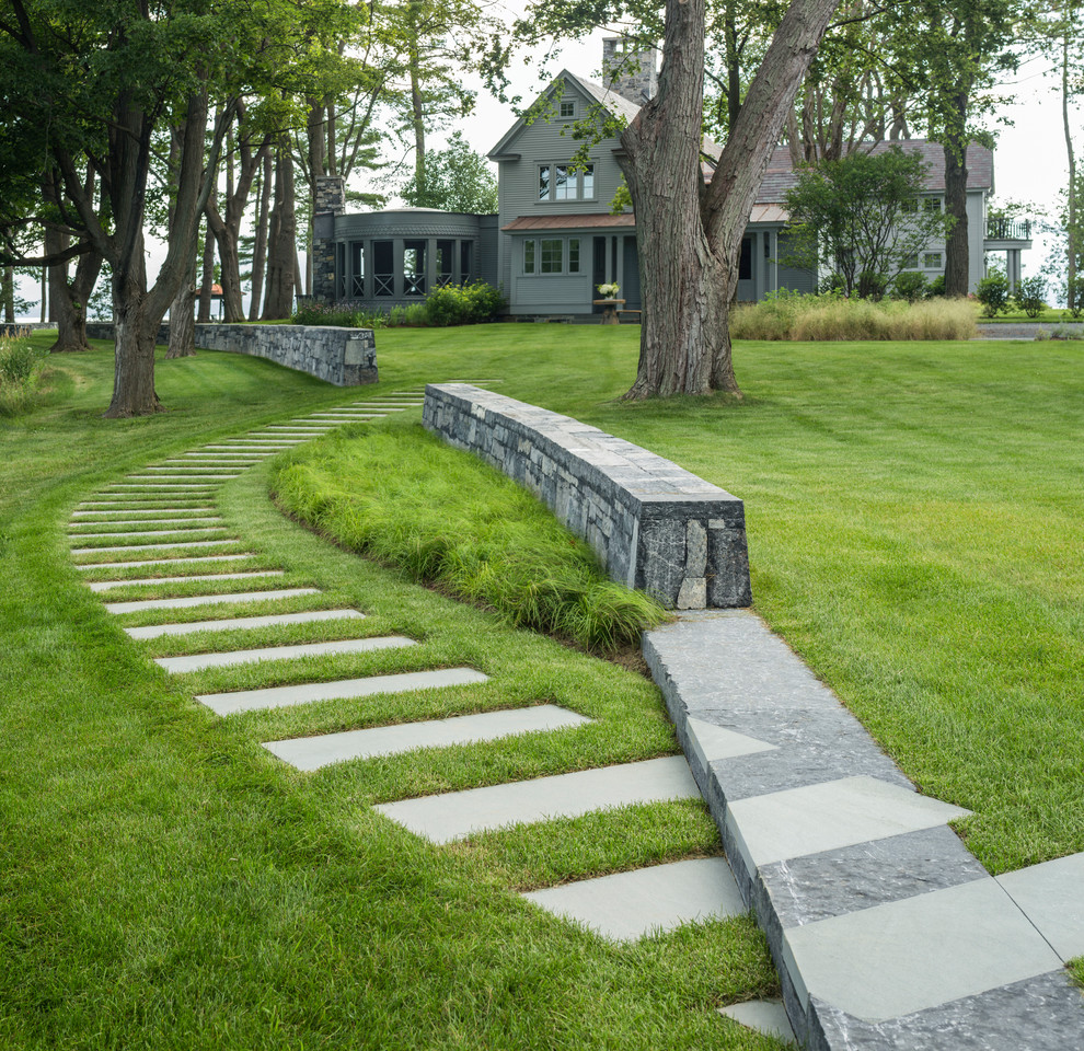 This is an example of a rural partial sun garden in Burlington with a garden path and concrete paving.