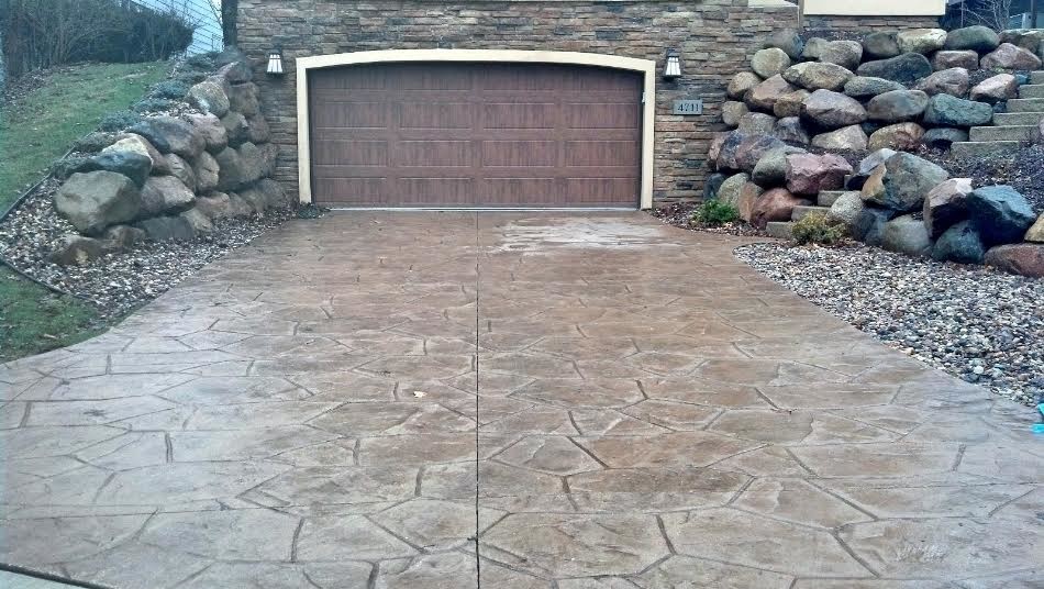Photo of a medium sized classic front driveway garden in Other with natural stone paving.