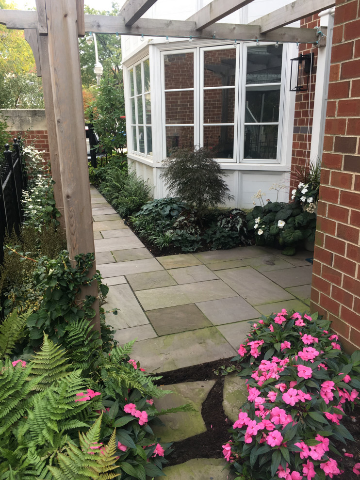 This is an example of a small contemporary partial sun side yard stone garden path.