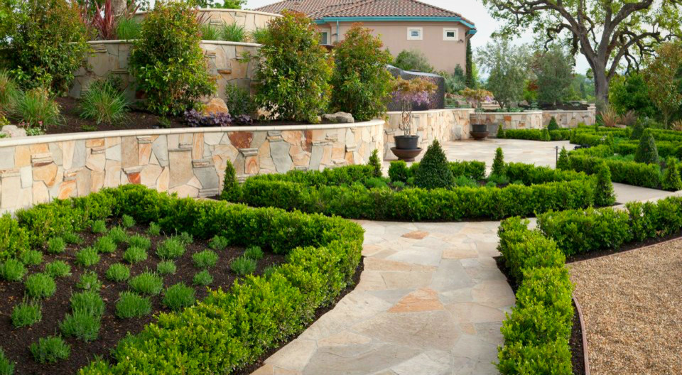 Design ideas for a large mediterranean full sun backyard stone landscaping in San Francisco for summer.