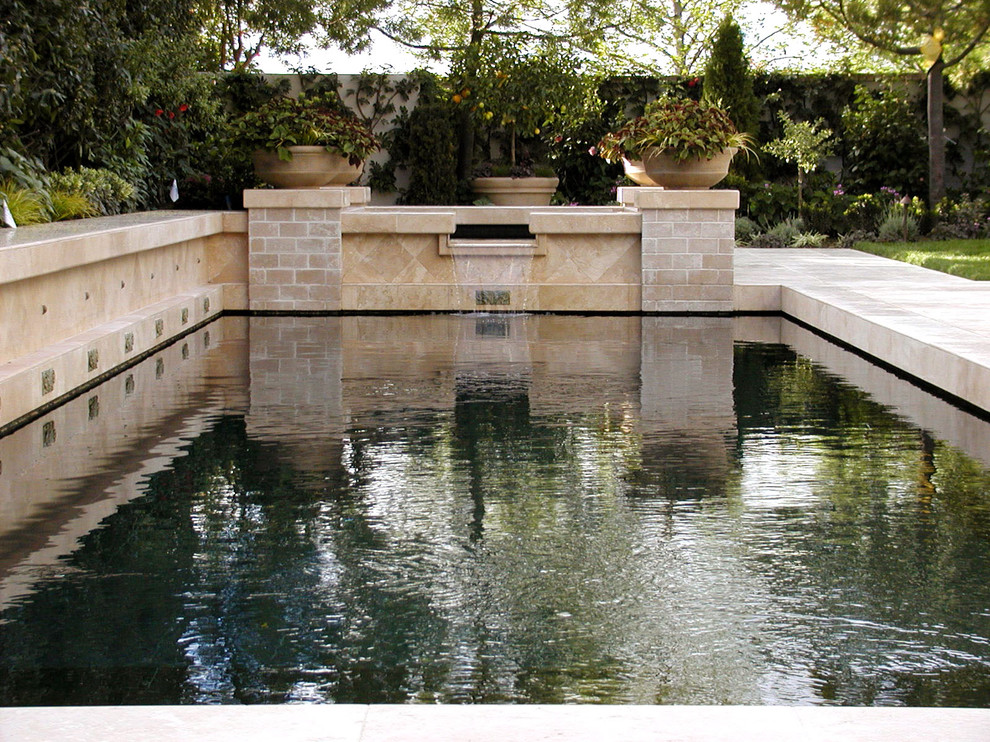 Photo of a mediterranean courtyard garden in Los Angeles with a water feature.