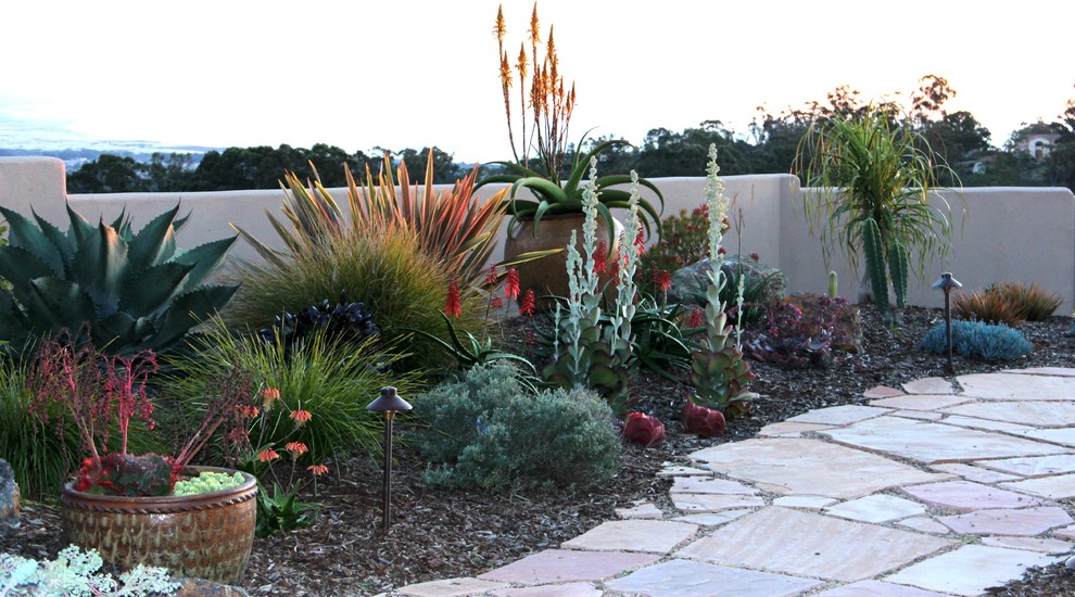 Mediterranean back xeriscape garden in San Luis Obispo with a garden path and natural stone paving.