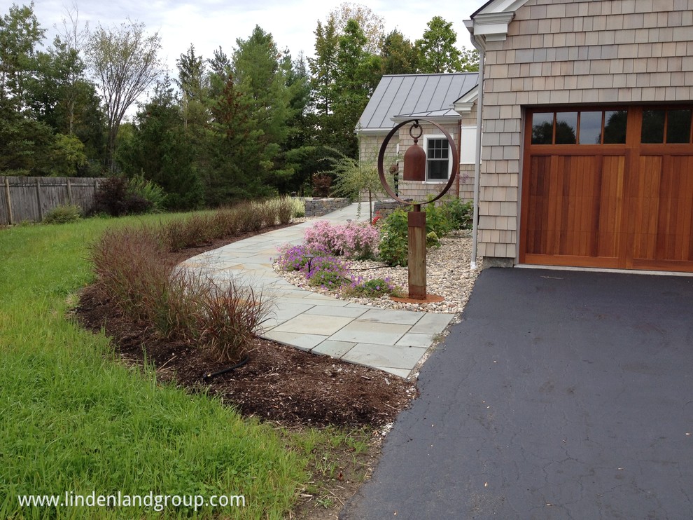 Inspiration for a medium sized contemporary front full sun garden in Burlington with a garden path and natural stone paving.