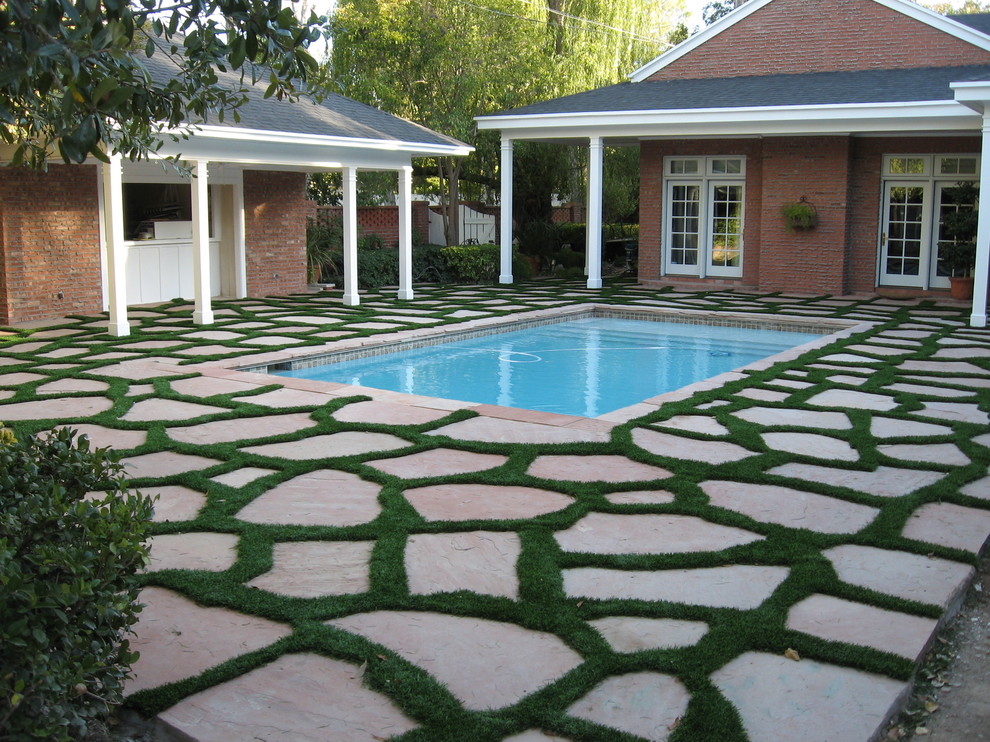 Artificial grass around flagstone Mediterranean Landscape Austin