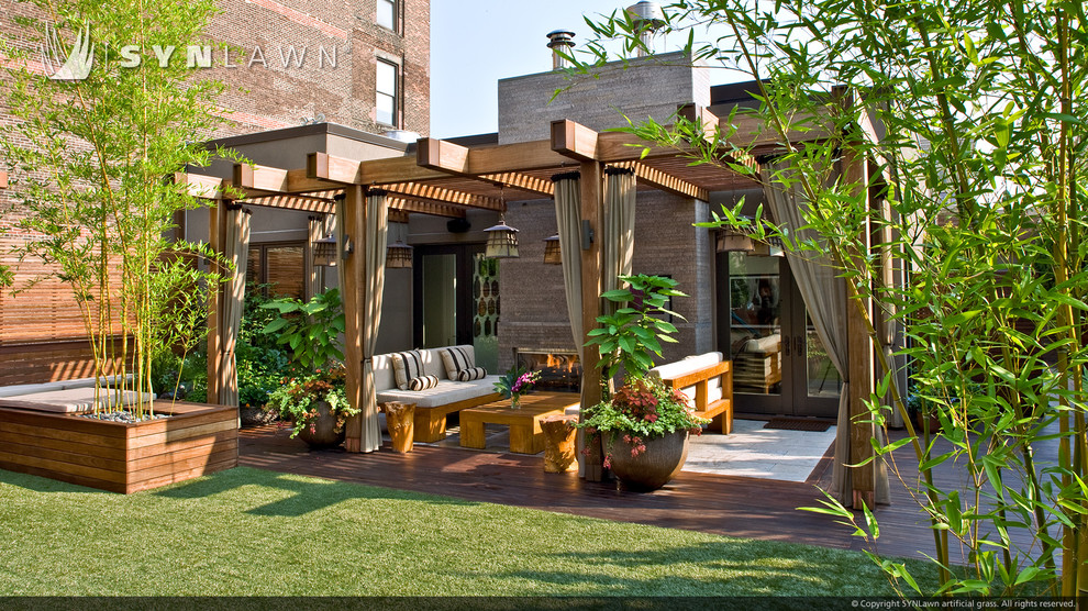 Photo of a small contemporary full sun rooftop landscaping in Other with decking.