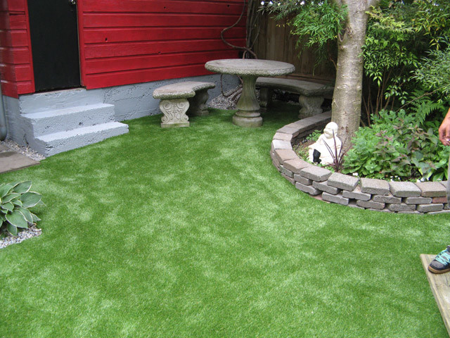 This is an example of a mid-sized shade backyard garden path in Vancouver for summer.