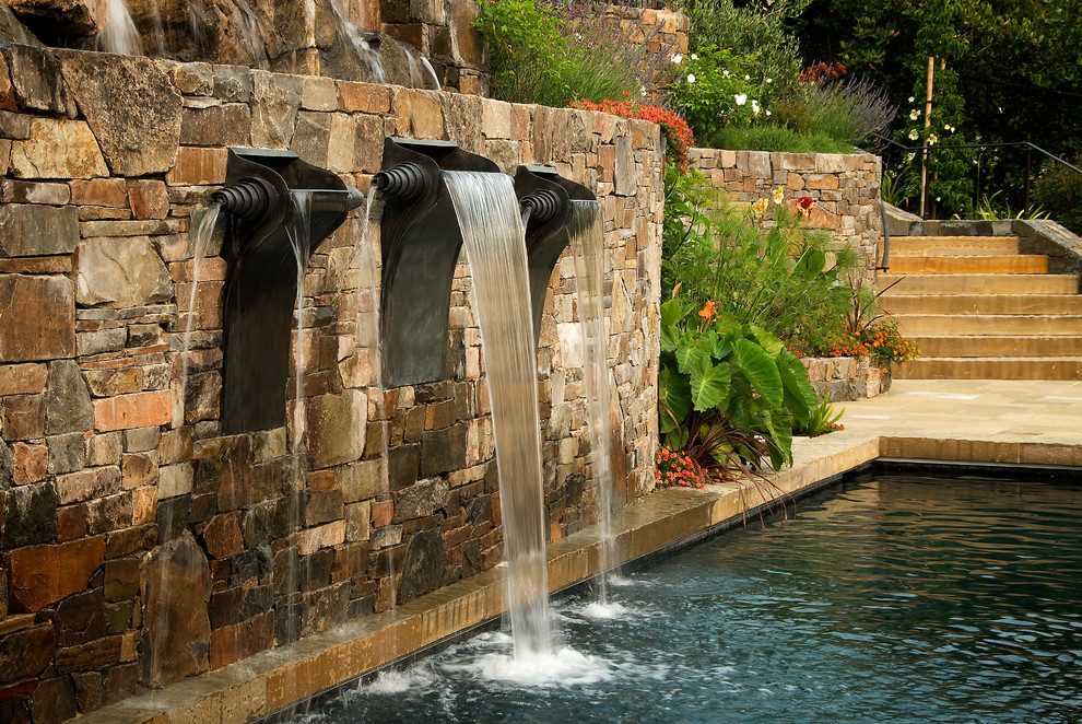 This is an example of a mediterranean garden in San Francisco with a water feature.