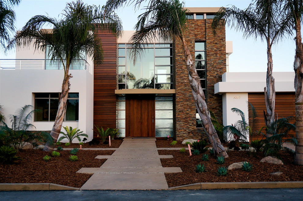 This is an example of a mid-sized modern full sun front yard concrete paver garden path in Santa Barbara.