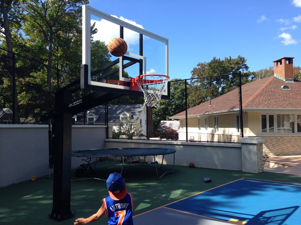 Photo of a large traditional partial sun backyard outdoor sport court in Philadelphia.