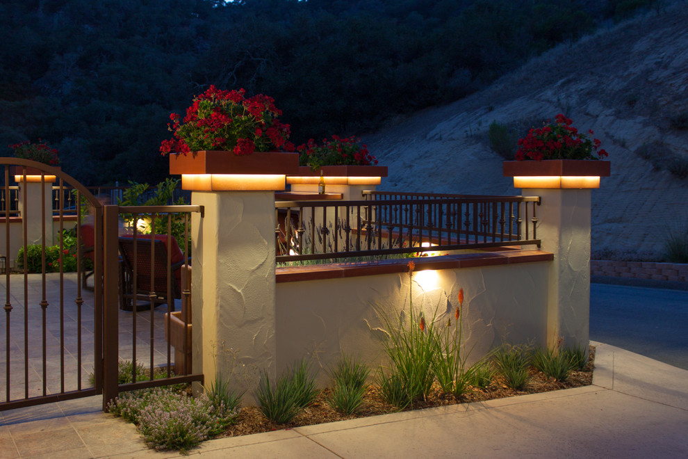 Inspiration for a small contemporary front full sun garden in San Luis Obispo with natural stone paving.