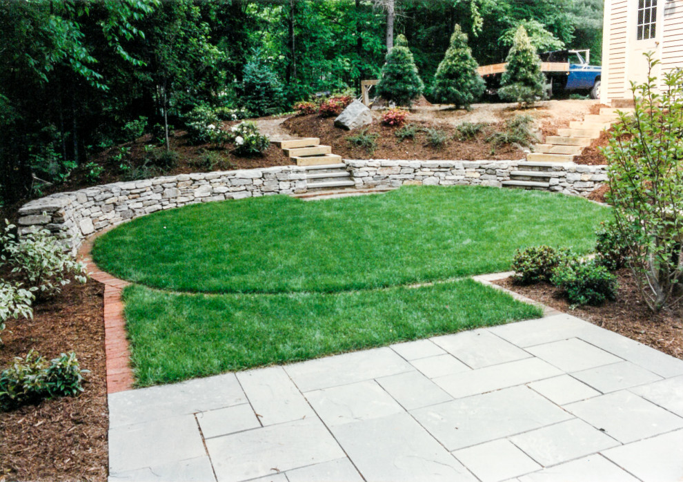 Design ideas for a medium sized contemporary back partial sun garden for spring in Bridgeport with decorative stones.