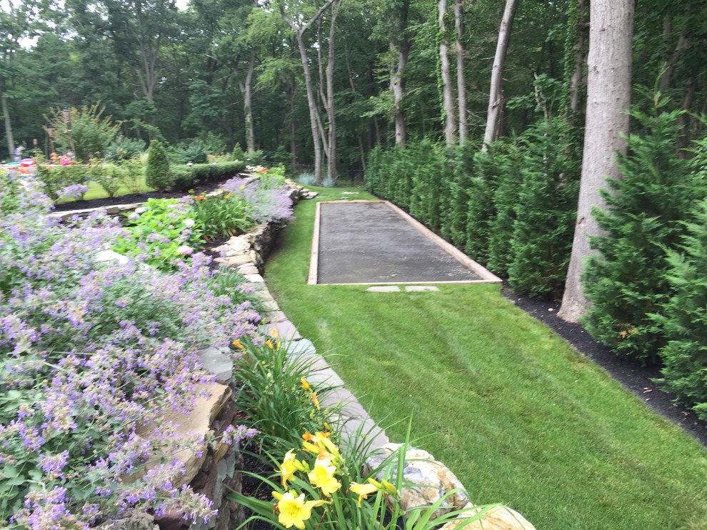 Inspiration for a large traditional back garden for summer in New York with an outdoor sport court.