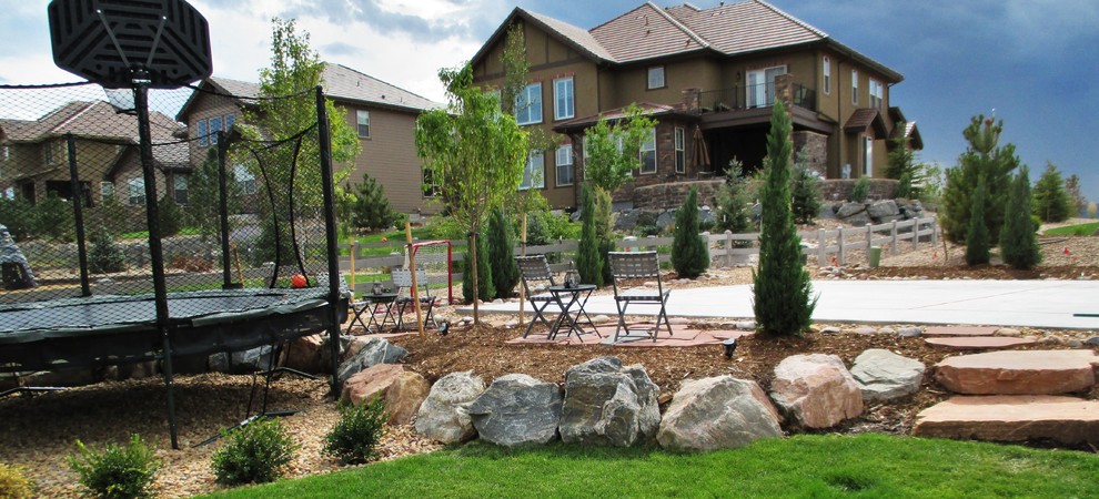 Inspiration for a large traditional back full sun garden for summer in Denver with an outdoor sport court and natural stone paving.