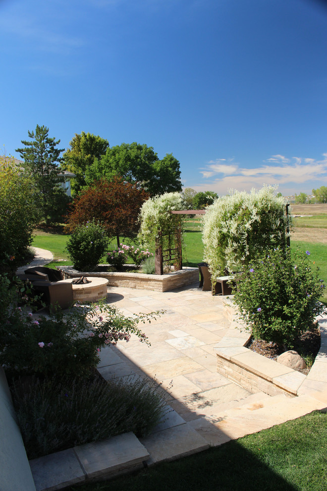 Design ideas for a large traditional drought-tolerant and full sun backyard garden path in Denver for summer.