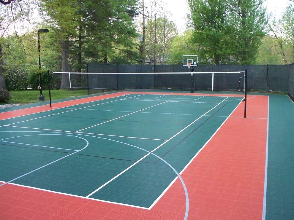 This is an example of a large modern back partial sun garden in New York with an outdoor sport court and a climbing frame.