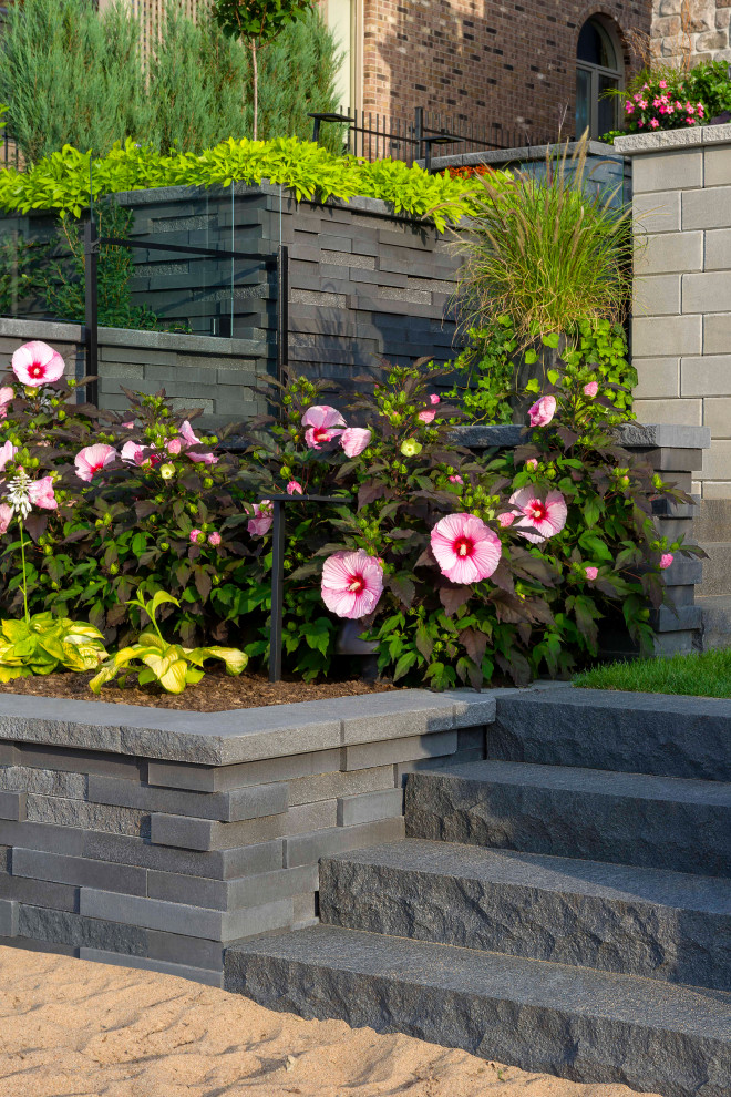 Design ideas for a modern front yard concrete paver landscaping in Ottawa.