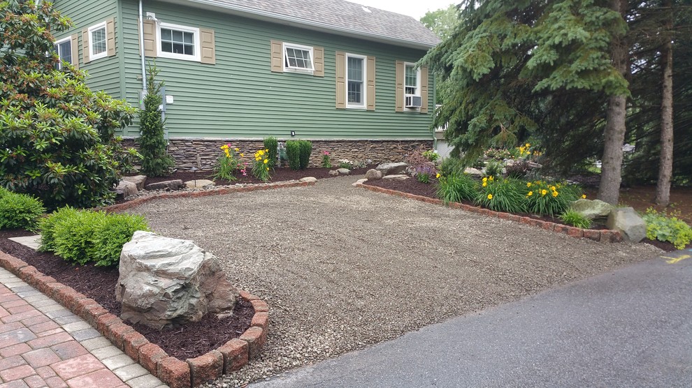Design ideas for a rustic backyard gravel driveway in Other.