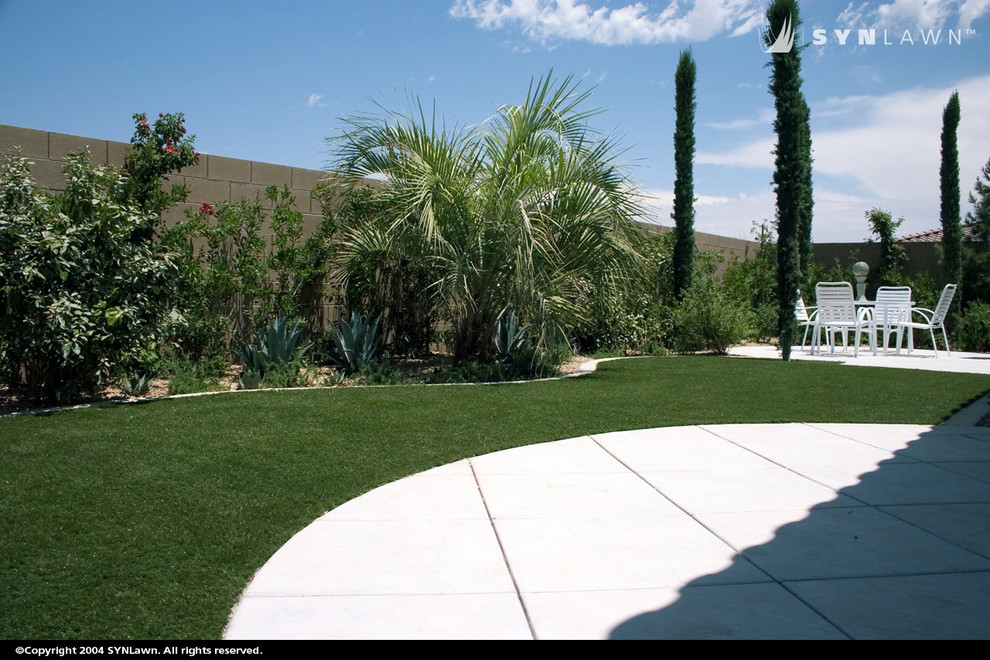 This is an example of a mid-sized southwestern backyard landscaping in Other.