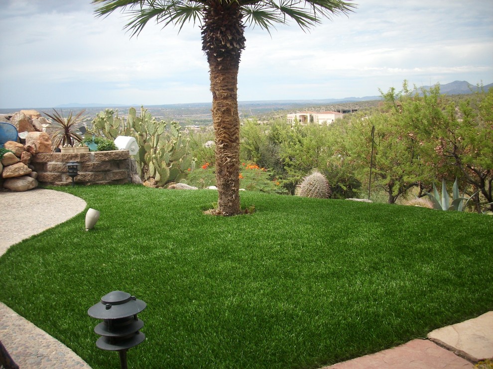 Design ideas for a small southwestern full sun backyard stone landscaping in Phoenix.