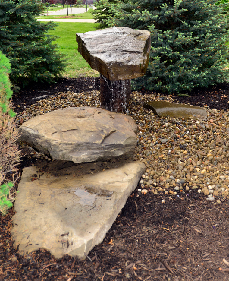 This is an example of a rustic water fountain landscape in Cleveland.