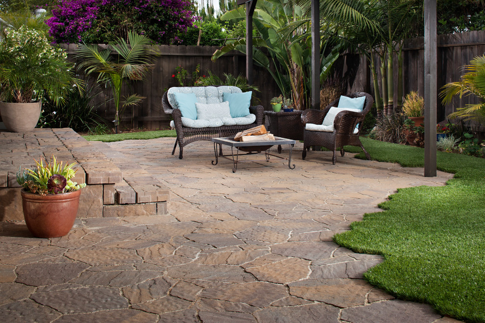 Photo of a medium sized contemporary back partial sun garden in San Diego with concrete paving and a fire feature.