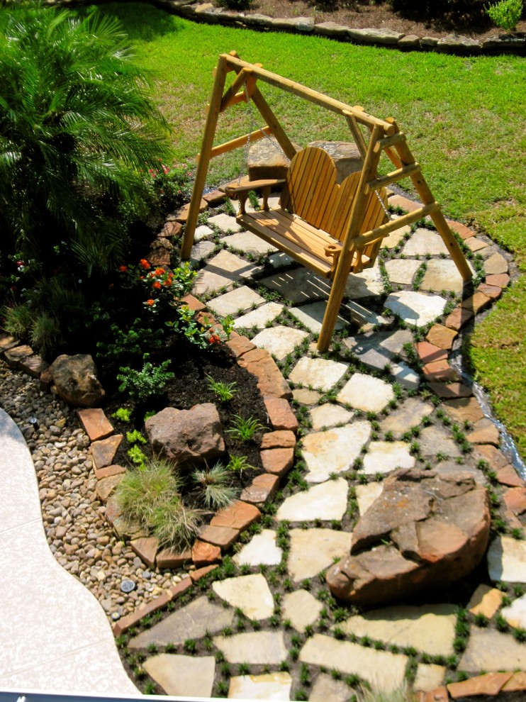 Photo of a tropical full sun backyard landscaping in Houston for spring.