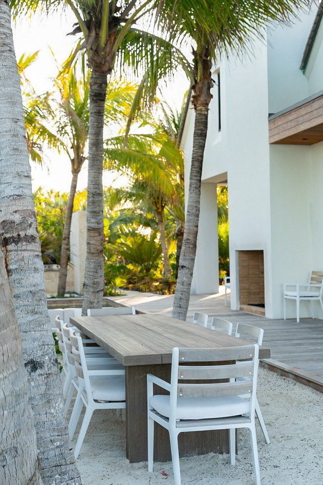 Photo of a huge coastal full sun backyard landscaping in Miami with decking.