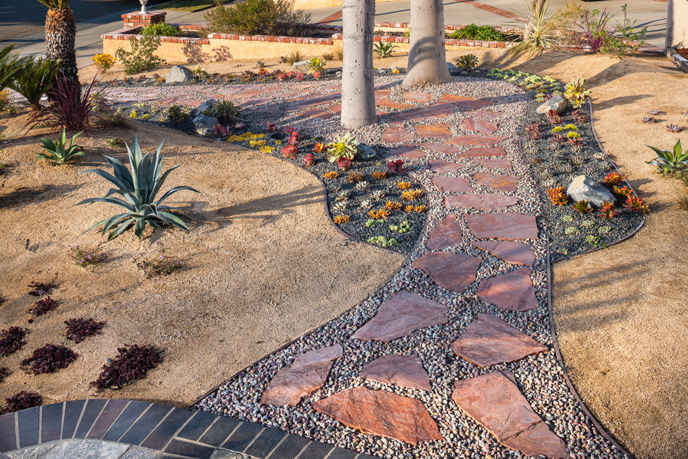 Inspiration for a medium sized world-inspired front xeriscape full sun garden in Orange County with a garden path and gravel.