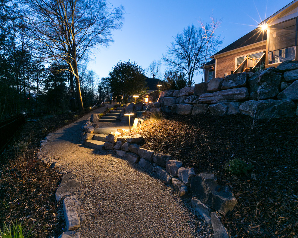 Design ideas for a large rustic full sun backyard gravel retaining wall landscape in Charlotte.