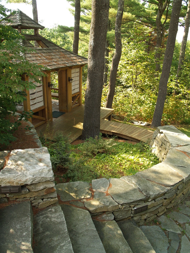 This is an example of a world-inspired garden steps in Burlington with natural stone paving.