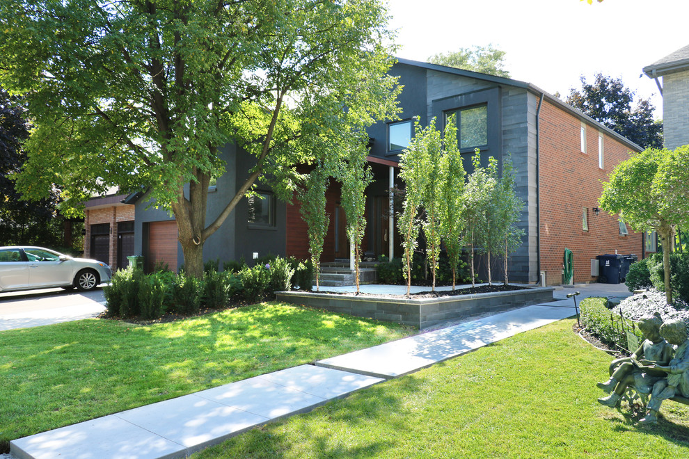 Пример оригинального дизайна: участок и сад среднего размера на переднем дворе в стиле модернизм с покрытием из каменной брусчатки