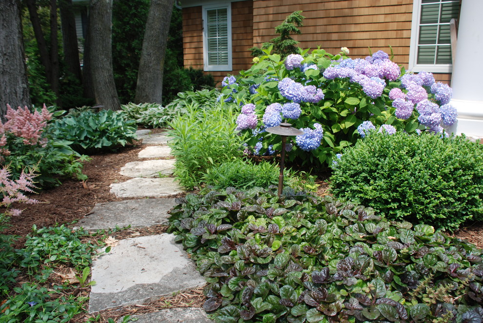 Inspiration for a coastal shade stone landscaping in Other.