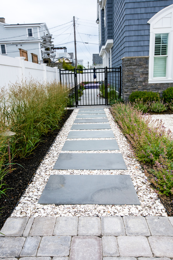 Inspiration for a medium sized beach style front garden in Boston with natural stone paving.