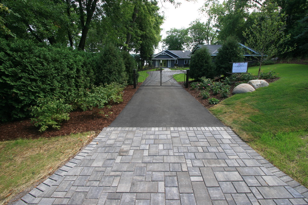 Inspiration for a mid-sized coastal front yard concrete paver driveway in Minneapolis.