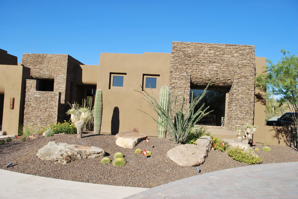 Design ideas for a large southwestern front yard concrete paver driveway in Phoenix.