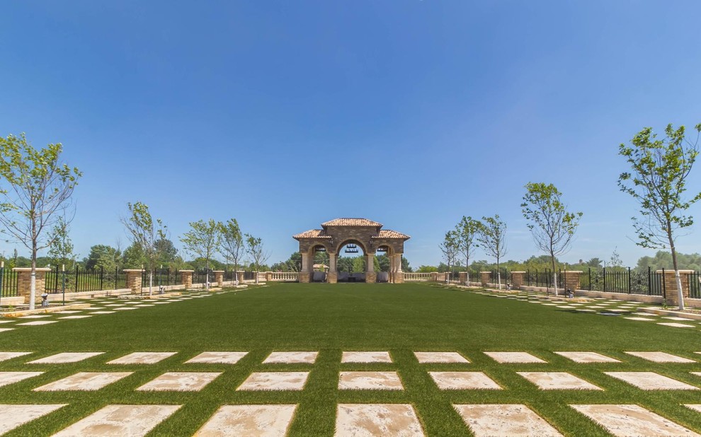 Design ideas for a large mediterranean full sun backyard concrete paver formal garden in Phoenix.