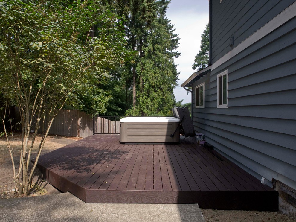 Design ideas for a small transitional shade backyard landscaping in Seattle with decking.