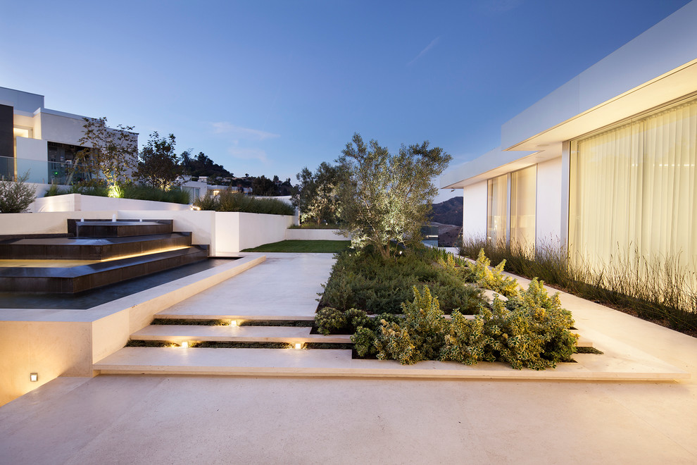 Contemporary garden in Orange County with a water feature.