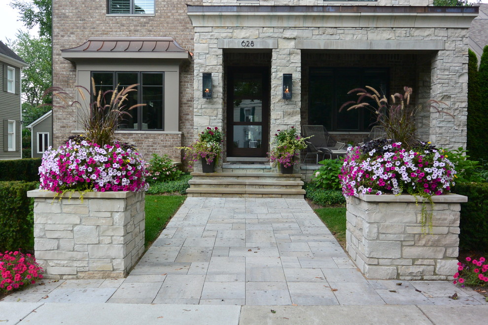 Design ideas for a small transitional partial sun front yard concrete paver formal garden in Detroit for summer.