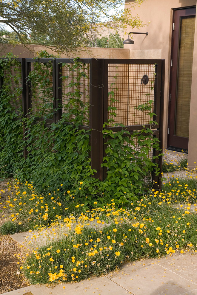 Design ideas for a mid-sized southwestern full sun backyard concrete paver formal garden in Phoenix for summer.