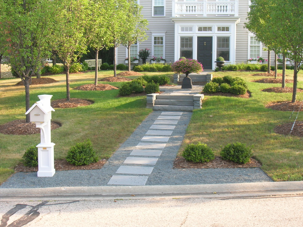 Photo of a large transitional front yard stone garden path in Chicago.