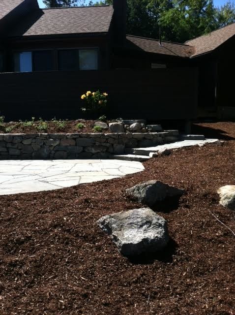 Photo of a medium sized classic garden in Boston with natural stone paving.