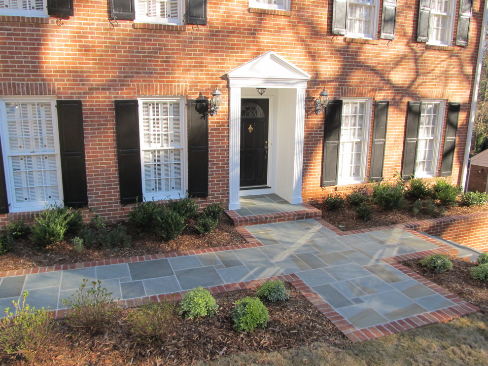Traditional front garden in Atlanta with natural stone paving.