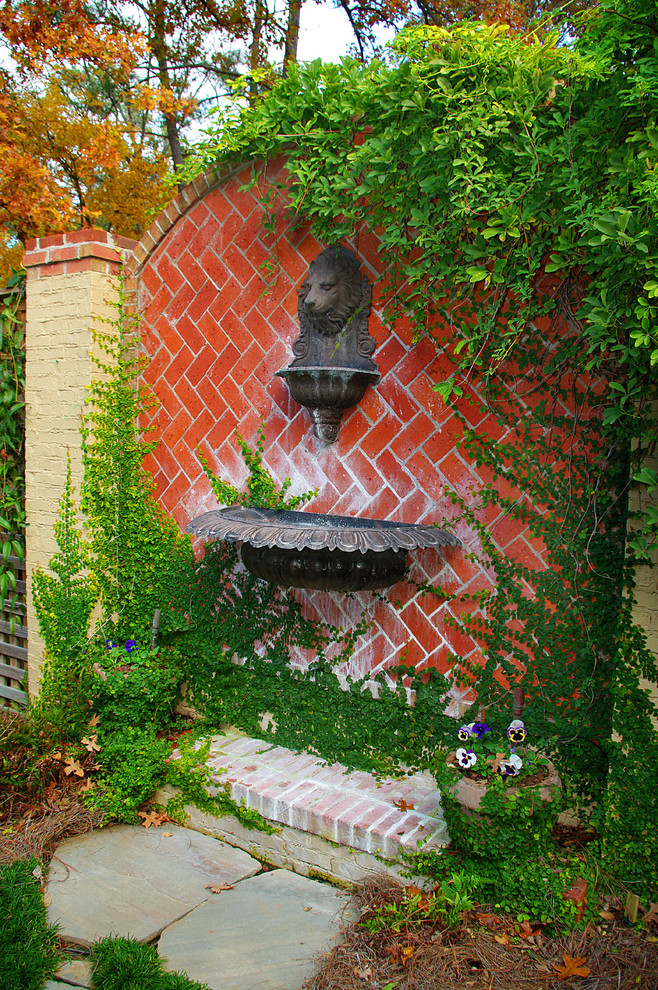 This is an example of a traditional garden wall in Birmingham with a water feature.