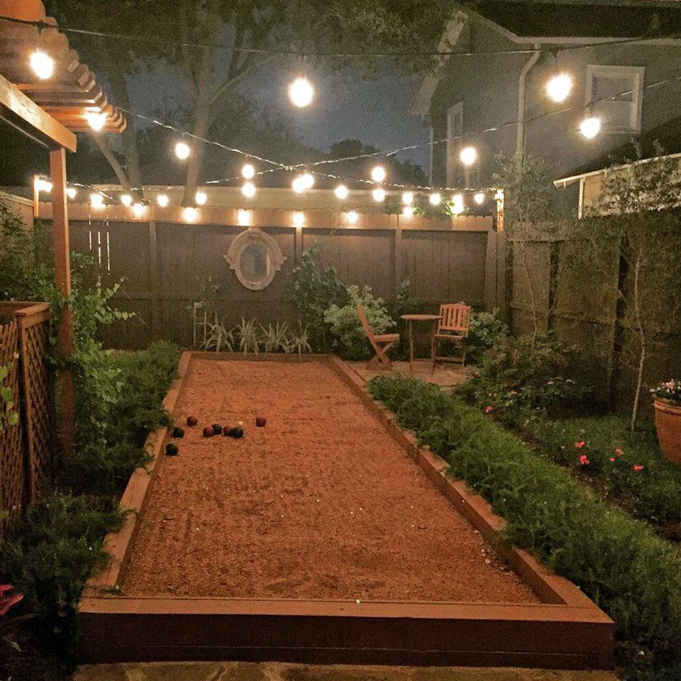Bocce ball and food in Montrose Traditional Garden Houston by