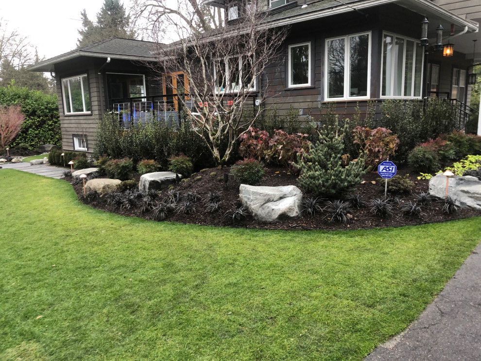 Inspiration for a huge backyard landscaping in Seattle.