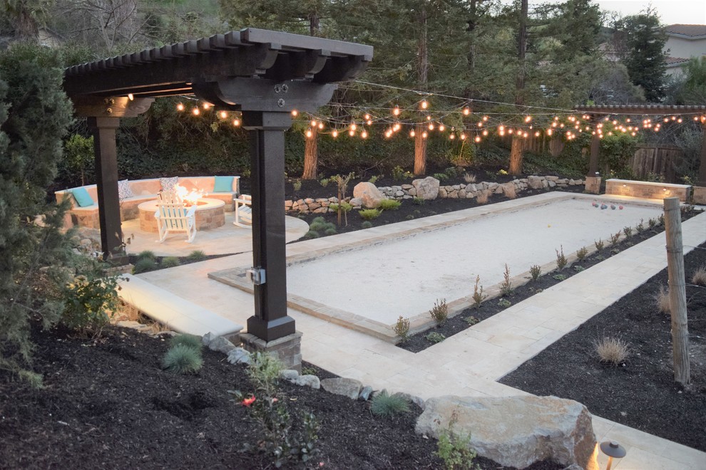 Inspiration for a large classic back xeriscape full sun garden for autumn in San Francisco with a fire feature and natural stone paving.